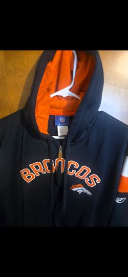 navy blue Denver Broncos full-zip hoodie featuring orange "BRONCOS" lettering and the team logo on the chest, branded with Reebok and the NFL Equipmen