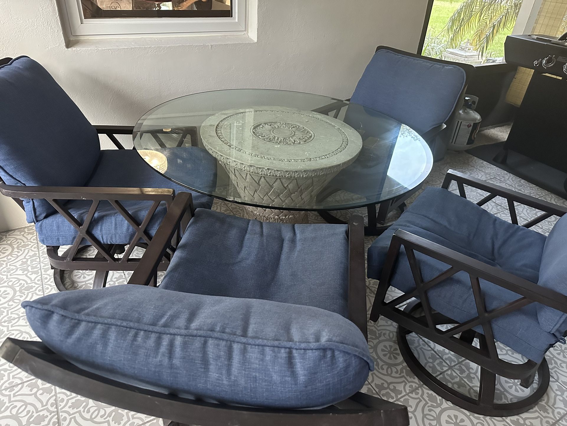 Round glass Top Table 48” Diameter With 4 Rocking Chairs And New Cushions