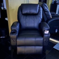 Black recliner chair with cup holder and footrest