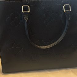 Bag By Louis Vuitton
