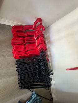 45 red and 25 black clothes hangers