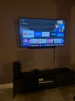 Samsung Smart TV with Soundbar and Subwoofer
