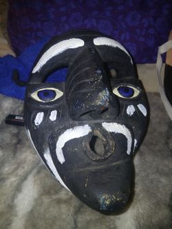 Vintage handcrafted black and white Ceremonial Decorative mask with blue eyes