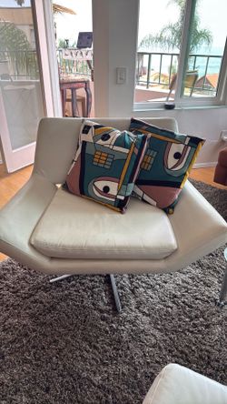 2  swivel  white leather chairs