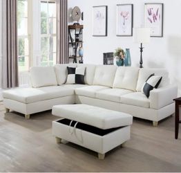 White leather sectional couch and ottoman