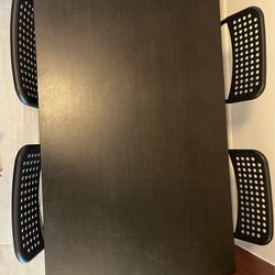 IKEA dining table with 4 chairs  , black in color