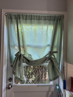 Sage green curtain and curtain rod