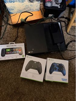 Xbox one with remotes and new backbone opened box never used