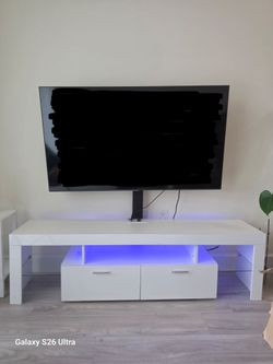 Modern White TV Stand with LED Lights & Storage – $85 OBO