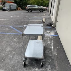 Utility cart with flush metal shelves