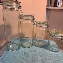 Set of 4 Green Panel Glass Jars w Balewire Lids
These are light green glass  Canisters 