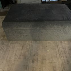 Grey fabric ottoman