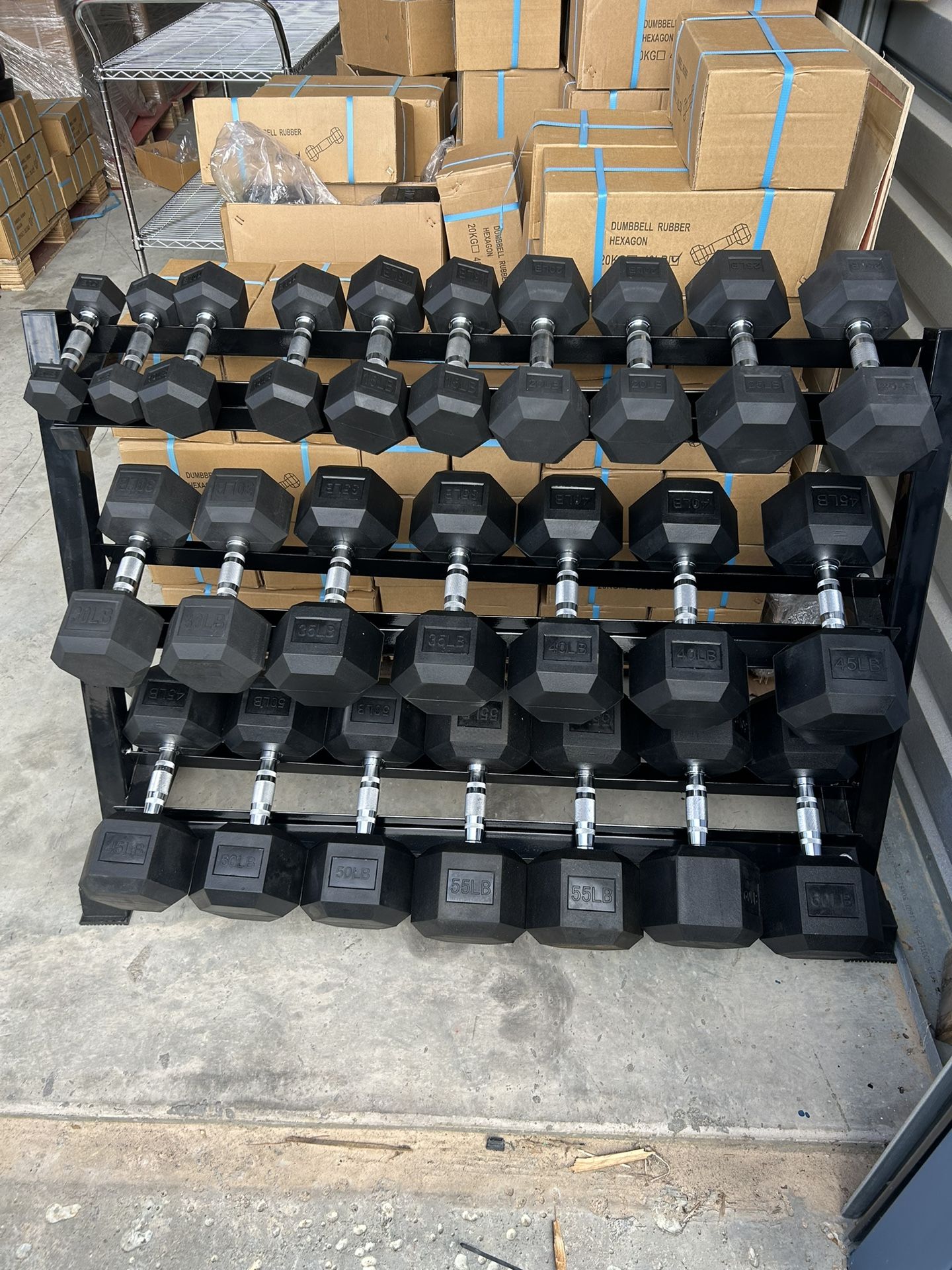 New pair of 5101520253035404550 5560lb rubber dumbbells + rack. All new in box $880