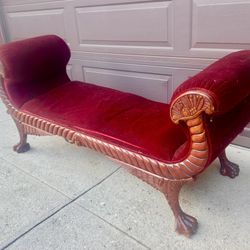 Baker Furniture French Empire Style sleigh bench featuring mahogany construction, red velvet upholstery, and carved winged paw feet.