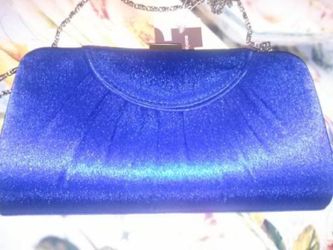 Brand new royal blue clutch with silver straps