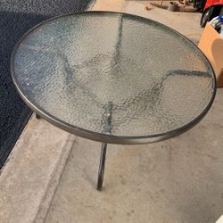 glass top metal base 18” x 35” dia 