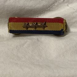 Navy & Marine Corps Overseas Service Ribbon with three bronze service stars indicating a fourth award
