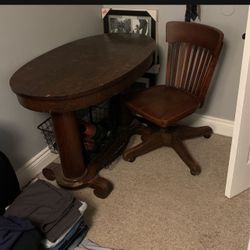 Antique oval table with Marble & Shattuck Chair Company swivel chair