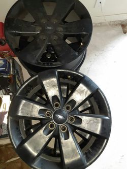 F150 stock rims for sale in black 20 inches 250 for all 4of them with lug nuts