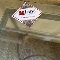 Selling three pieces, coffee and end table by Lane furniture never used been kept covered in the garage