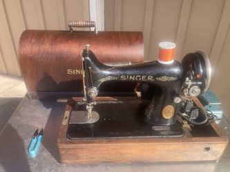 1926 Singer With A Bentwood Carry Case. It has been serviced and is working great.