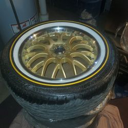 Vogue Tires Sitting On Gold And Chrome Rims