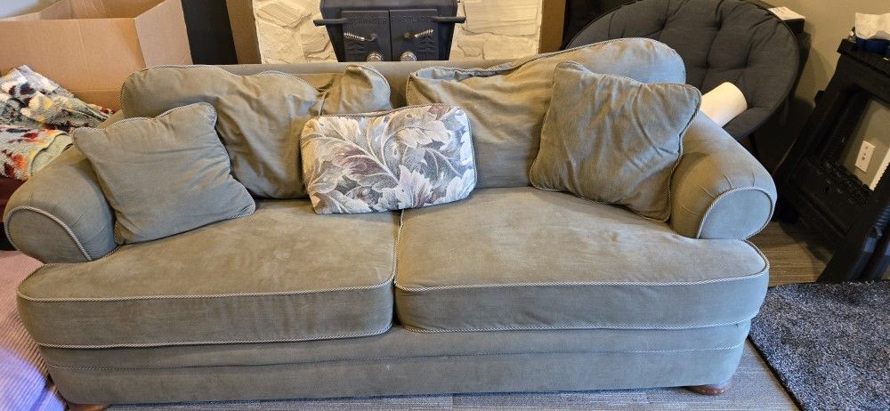Comfy Green Couch And Pillows