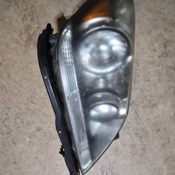 Passenger-side (right) headlight assembly for a Honda Odyssey, specifically matching models from 2005 to 2010. 