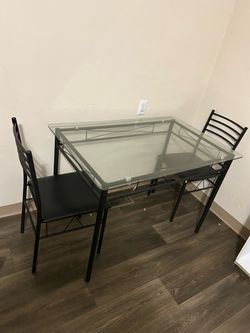 Glass table with chairs