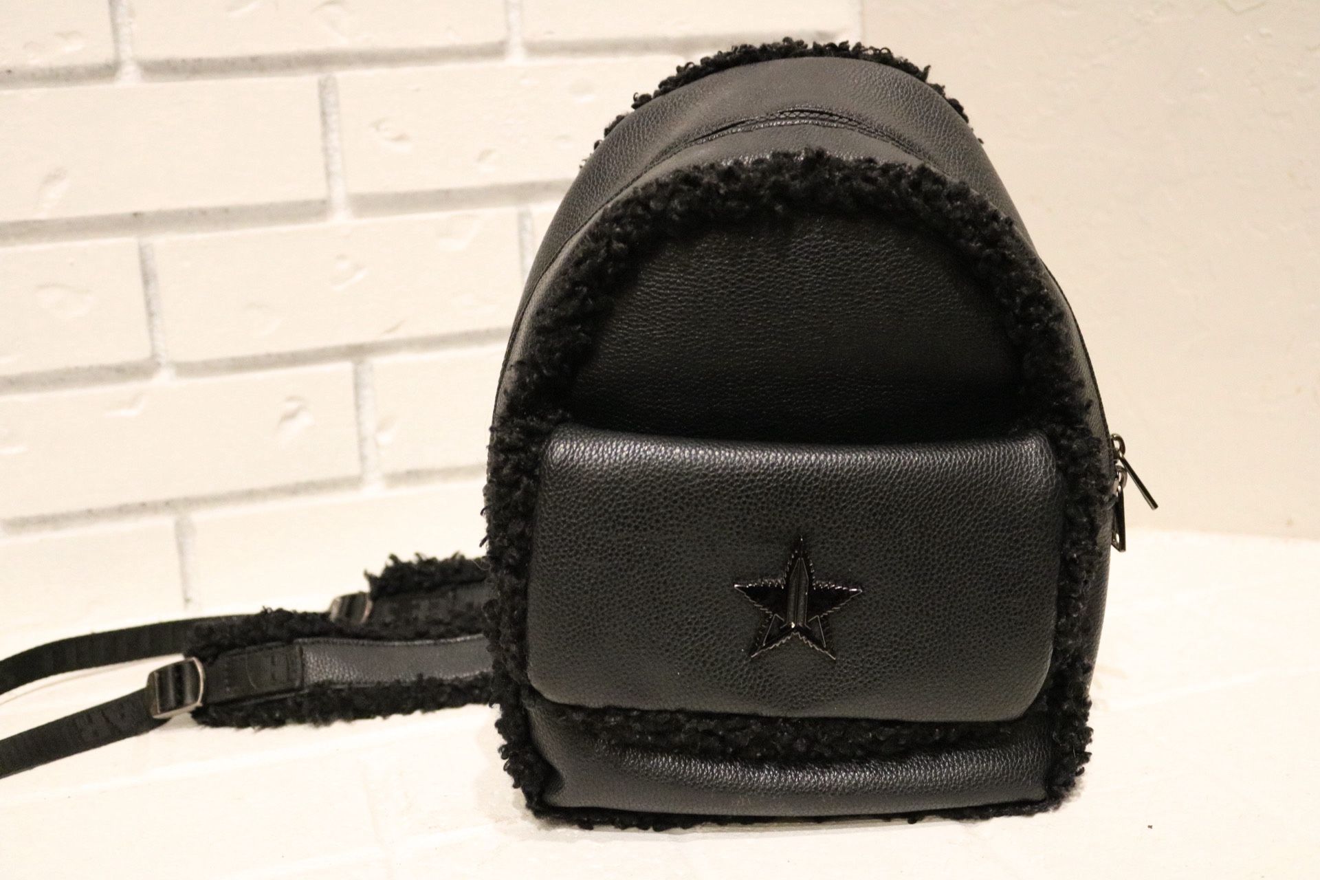Jeffree Star Star Lounge backpack in black with a faux fur trim
