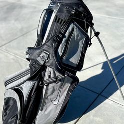 Nike Xtreme Sport Carry III Stand Bag. This model was released around 2010 and is a lightweight carry bag featuring a black and gray color scheme. 