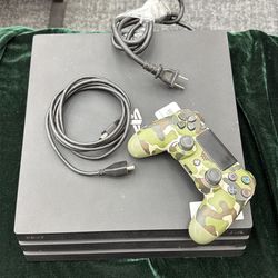 PlayStation 4 pro with controller