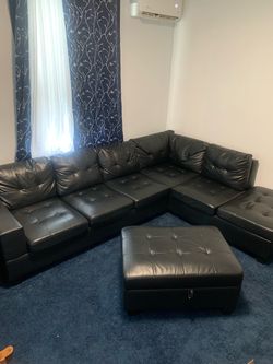 Black leather L-shaped sofa