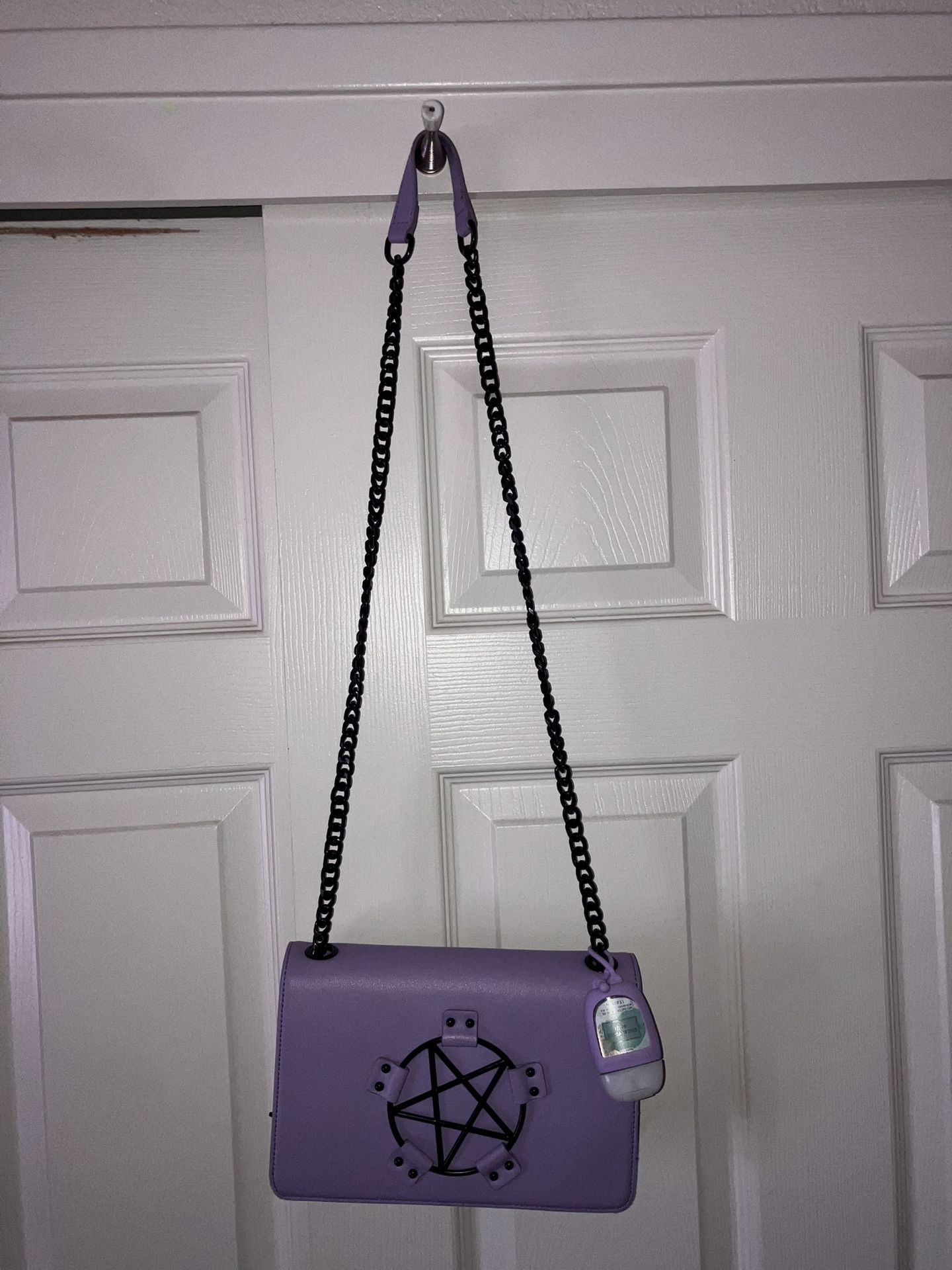 Black Craft purse with hand sanitizer