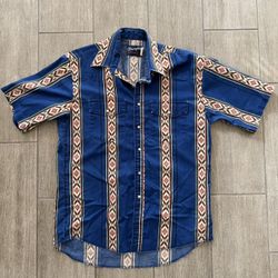 Vintage 1990s Wrangler short-sleeve blue denim western shirt with a Southwestern/Aztec pattern and pearl snap buttons