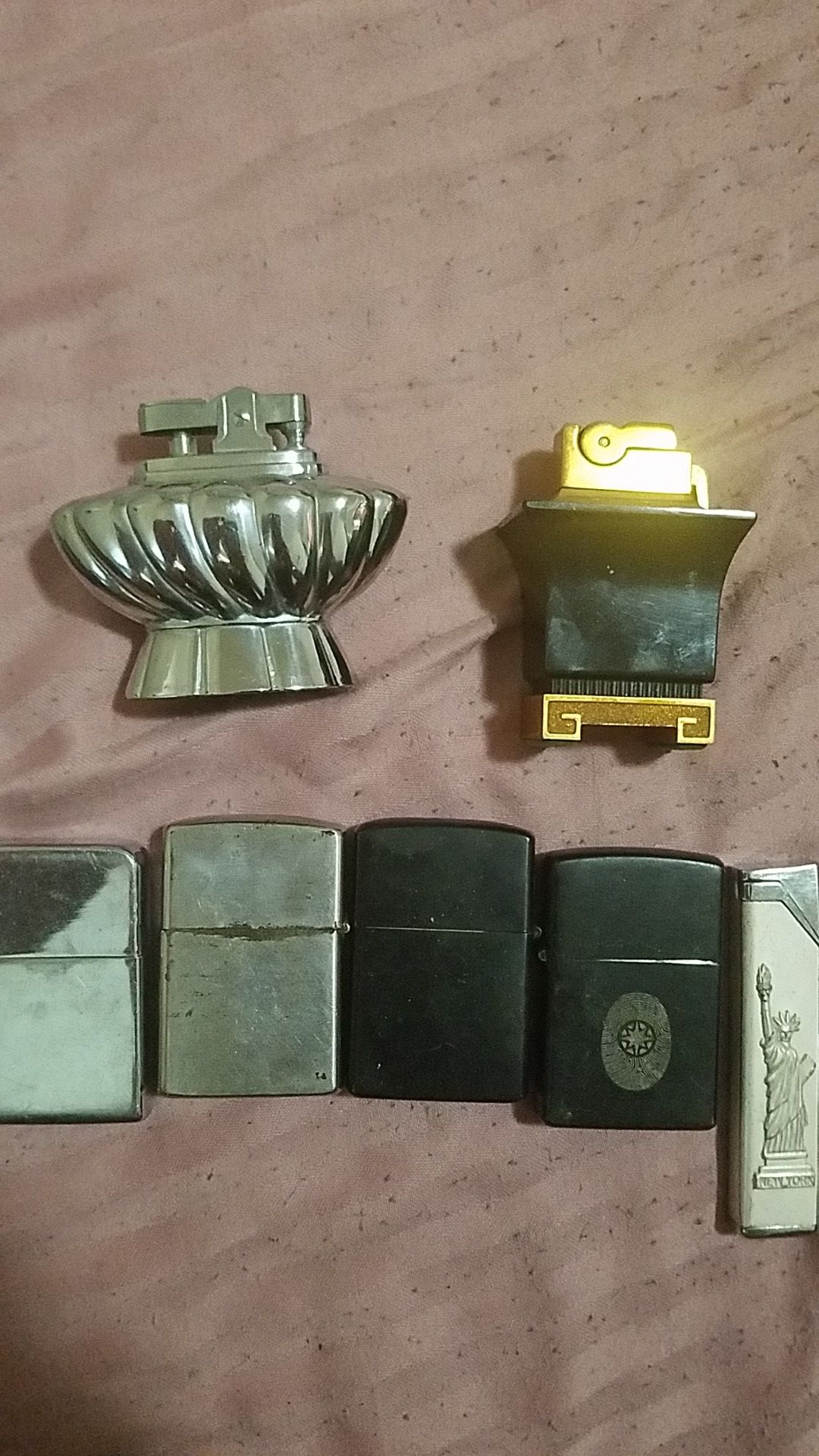 Antique table top lighters and zippos