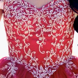 Red ball gown for Quinceañera or Sweet 16. Gold beaded accents with champagne colored flowers  
