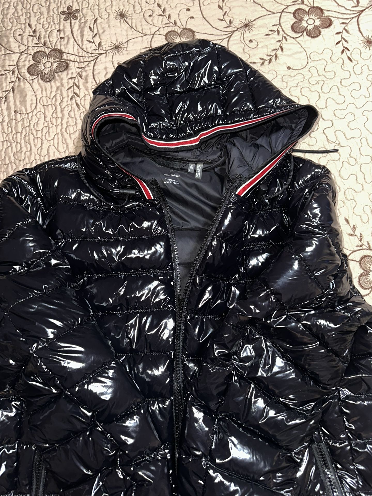 black calvin klein puffer jack with red strips