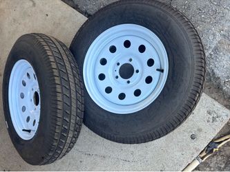 2 trailer wheels and tires