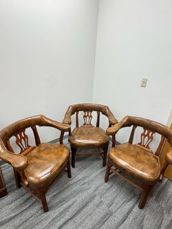 Chippendale-style leather barrel arm chairs