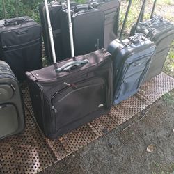 LOTS OF NICE PULL ALONG LUGGAGE 