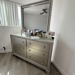 CHANPAGNE COLORED QUEEN SIZE BED FRAME AND VANITY DRESSER. Mattress not included.