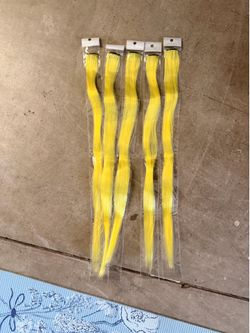 Yellow clip in hair extensions