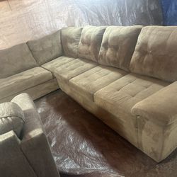 Brown L-shaped couch with ottoman great condition clean we sell all the time delivery extra 40 local