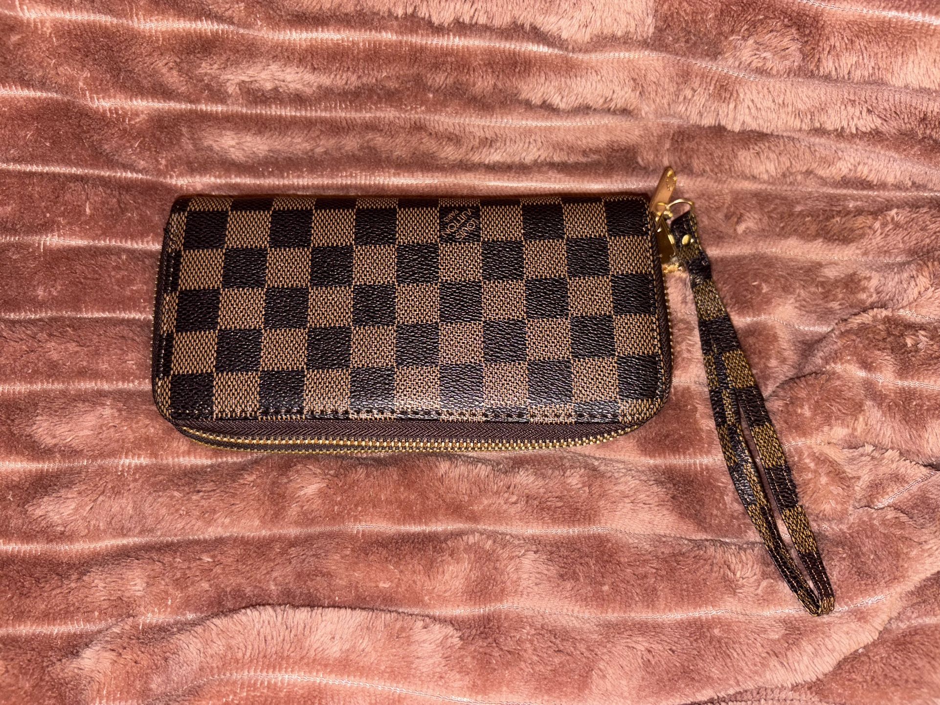 L V designer, zippy wallet