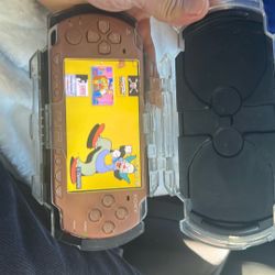 Brown Psp With Case And Over 1000 Games Loaded 