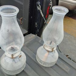 Two Oil Lamps And A Bottle Of Oil