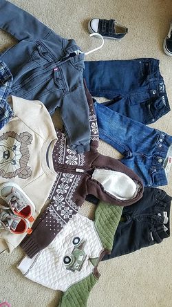2 Levi Jean's, Levi jacket 3 sweaters and converse size 5 clothing 18 -24 months
