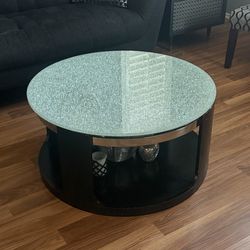 round glass-top coffee table