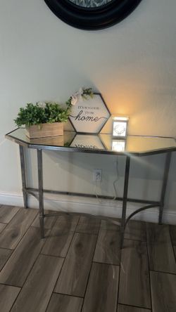 Half moon mirror table with silver legs